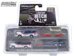 1/64 Racing Hitch & Tow Series 3 - 1992 Ford F-150 and 1992 Ford Bronco BF Goodrich Rough Riders on Flatbed Trailer