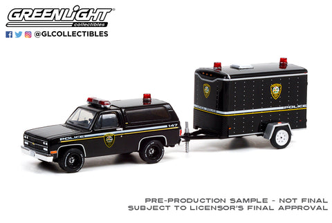 32220-D | 1:64 Hitch & Tow Series 22 - 1990 Chevrolet K5 Blazer Utica, New York Police Department with Small Cargo Trailer Solid Pack